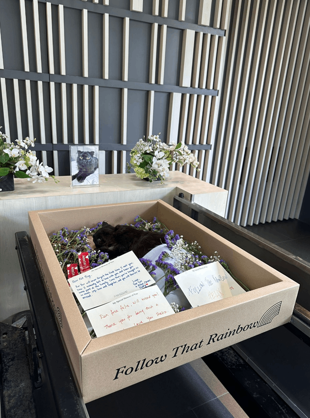 Felix surrounded by flowers and farewell messages at his private memorial