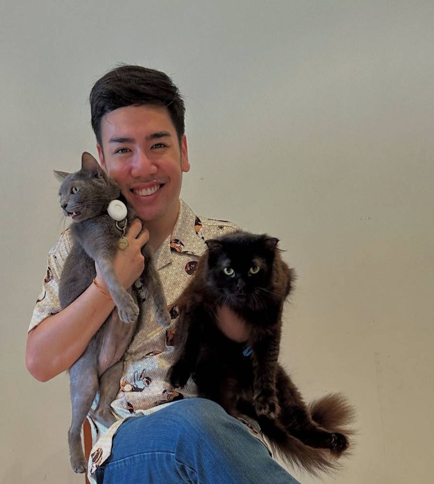 Ben with his adopted rescue cat Felix and another family cat
