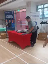 Singapore Police Force and ScamShield community safety display.