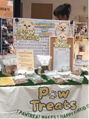 Paw Treats stall displaying dehydrated pet treats.