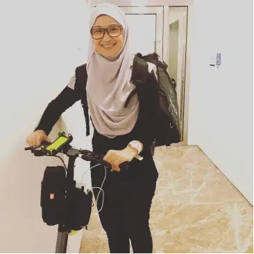 Zuraidah, known as Ida, lead organiser of Pawtection Day, holding a cat.